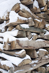 Image showing stacked wood and snow