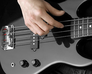 Image showing hand on bass guitar