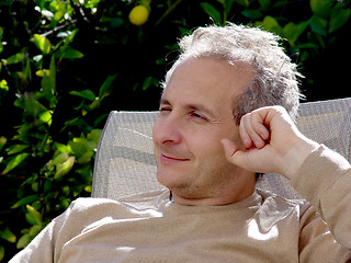 Image showing A middleage man with gray hair