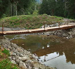 Image showing wooden bridge and stream