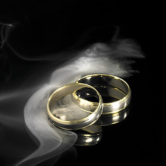 Image showing golden wedding rings and smoke