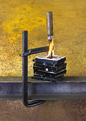 Image showing burning vise and hard disks