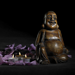 Image showing Buddha sculpture in dark back