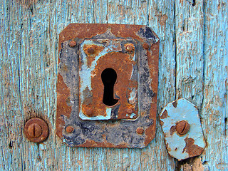 Image showing Blue door with rusty keyhole