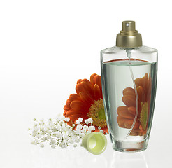 Image showing perfume bottle and floral decoration