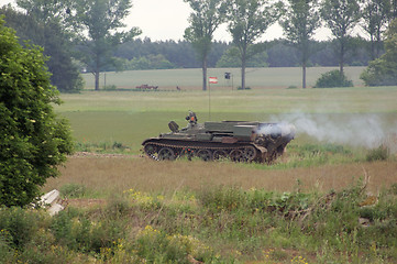 Image showing offroad scenery with driving tank