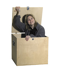 Image showing girl sitting in a wooden box
