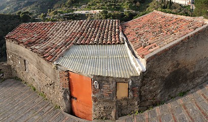 Image showing Old poor house under the  tile roof