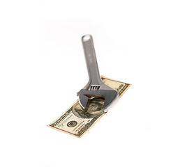 Image showing wrench and dollar bill isolated on white