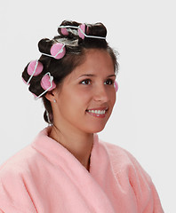 Image showing Woman with hair curlers