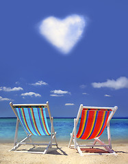 Image showing stripy chairs on the beach 