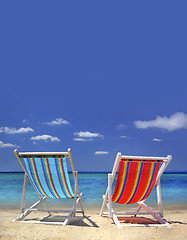 Image showing stripy chairs on the beach 