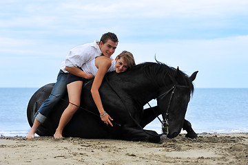 Image showing couple and  horse on the beach