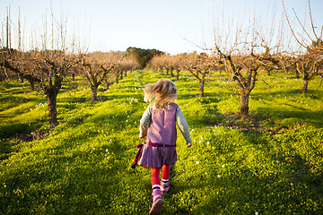 Image showing Little girl running outdoors