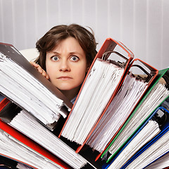 Image showing Accountant swamped with financial documents