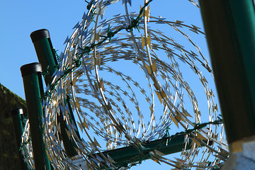 Image showing barbed wire against blue sky