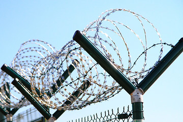 Image showing barbed wire against blue sky 