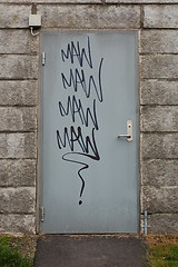 Image showing Steel door with grafitti