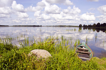 Image showing Lake boats water rest coast sky clouds reflections 