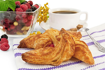 Image showing Bun and coffee berries on a napkin