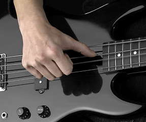 Image showing hand on bass guitar