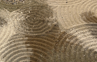 Image showing circles on multicolored sand surface