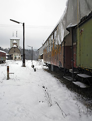 Image showing old railway cars and station