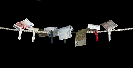 Image showing clothesline and money