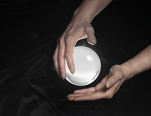 Image showing crystal ball and hands around