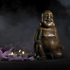 Image showing Buddha sculpture in dark back