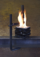 Image showing burning vise and hard disks