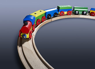 Image showing colorful wooden toy train on tracks