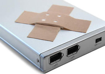 Image showing portable hard disc and adhesive plastrer