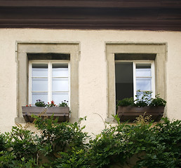 Image showing house facade detail with two old windows