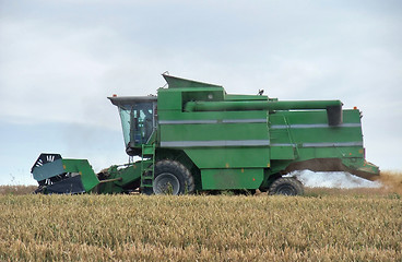 Image showing harvesting harvester on a crop field