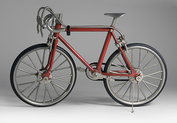 Image showing model of a red framed bicycle