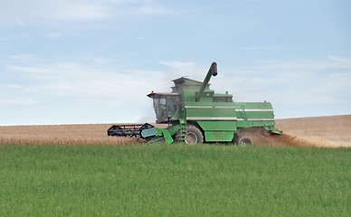 Image showing harvesting harvester on a crop field