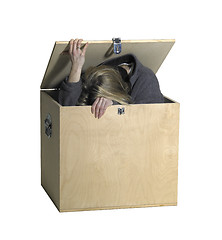 Image showing girl sitting in a wooden box