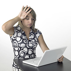 Image showing cute blonde girl finished computer work