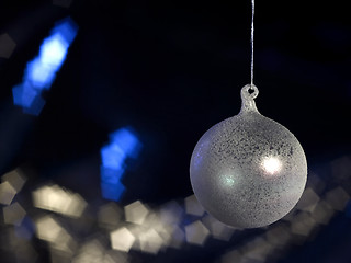 Image showing translucent Christmas bauble in dark back