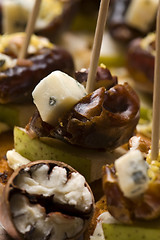 Image showing Appetizer Plate with Dactyl, Pecan nuts and Cheese