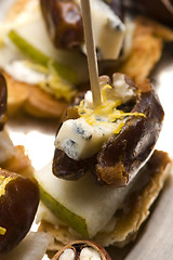 Image showing Appetizer Plate with Dactyl, Pecan nuts and Cheese