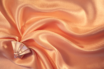 Image showing Silver fan from nacre on the elegant pink silk 