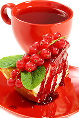 Image showing Crepe cake and a red cup of tea.