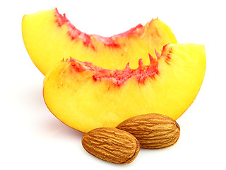 Image showing Slices of peach with almonds