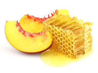 Image showing Sweet slices of nectarine with honeycombs