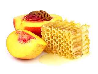 Image showing Ripe peach with honeycombs