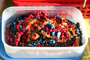 Image showing Plastic box loaded with colorful jewelry beads 