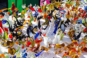 Image showing handmade colorful glass toys sold in outdoor fair 