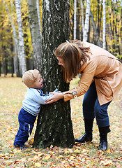 Image showing Mother with son play seek and hide